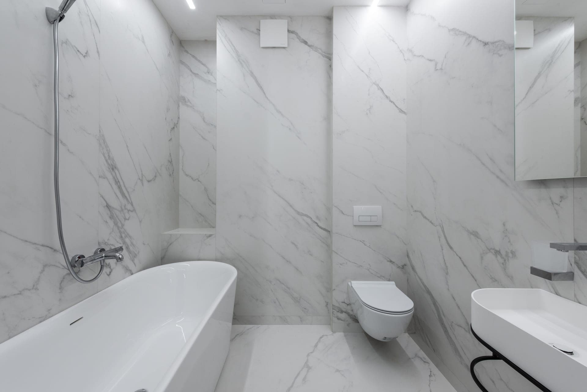 A bathroom with a bathtub and a toilet