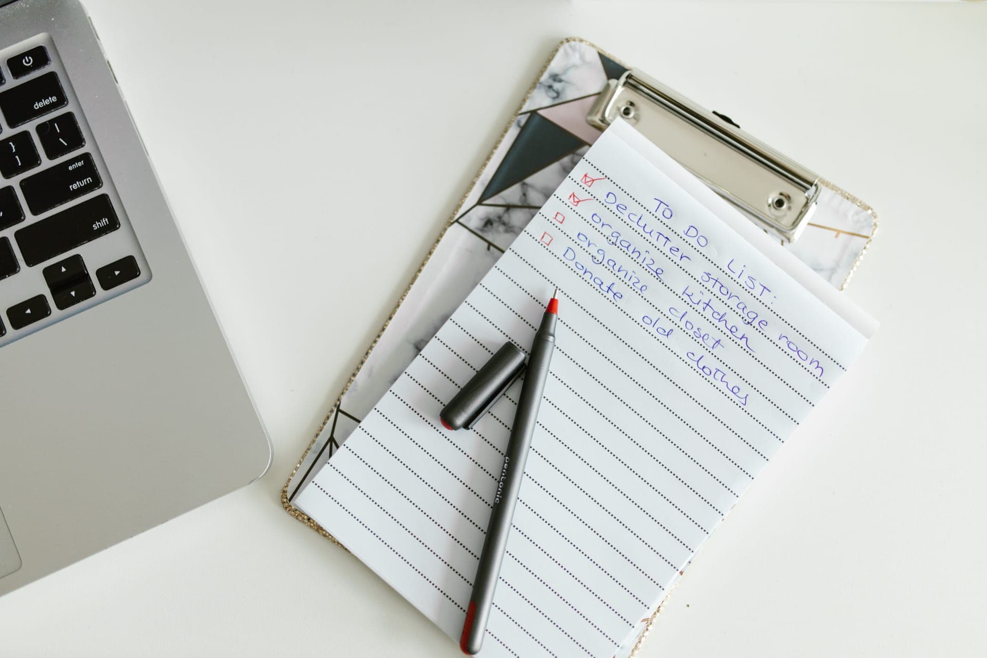 A clipboard with a checklist and a pen