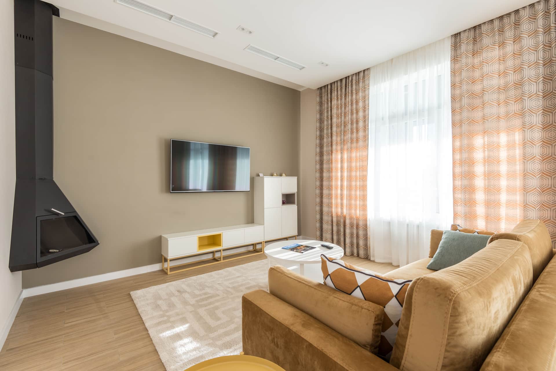 A television mounted on a living room wall