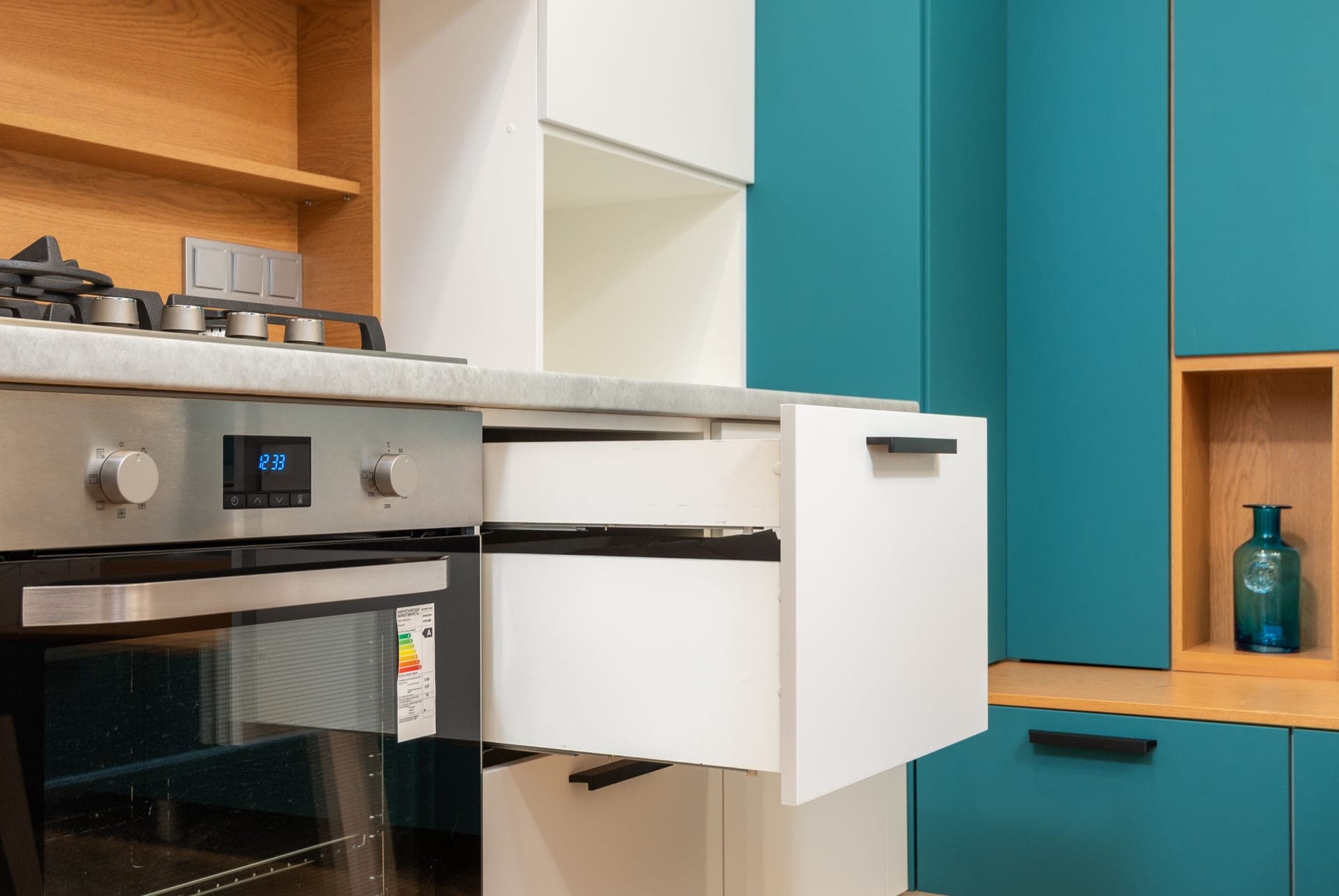 Two kitchen cabinet handles side by side