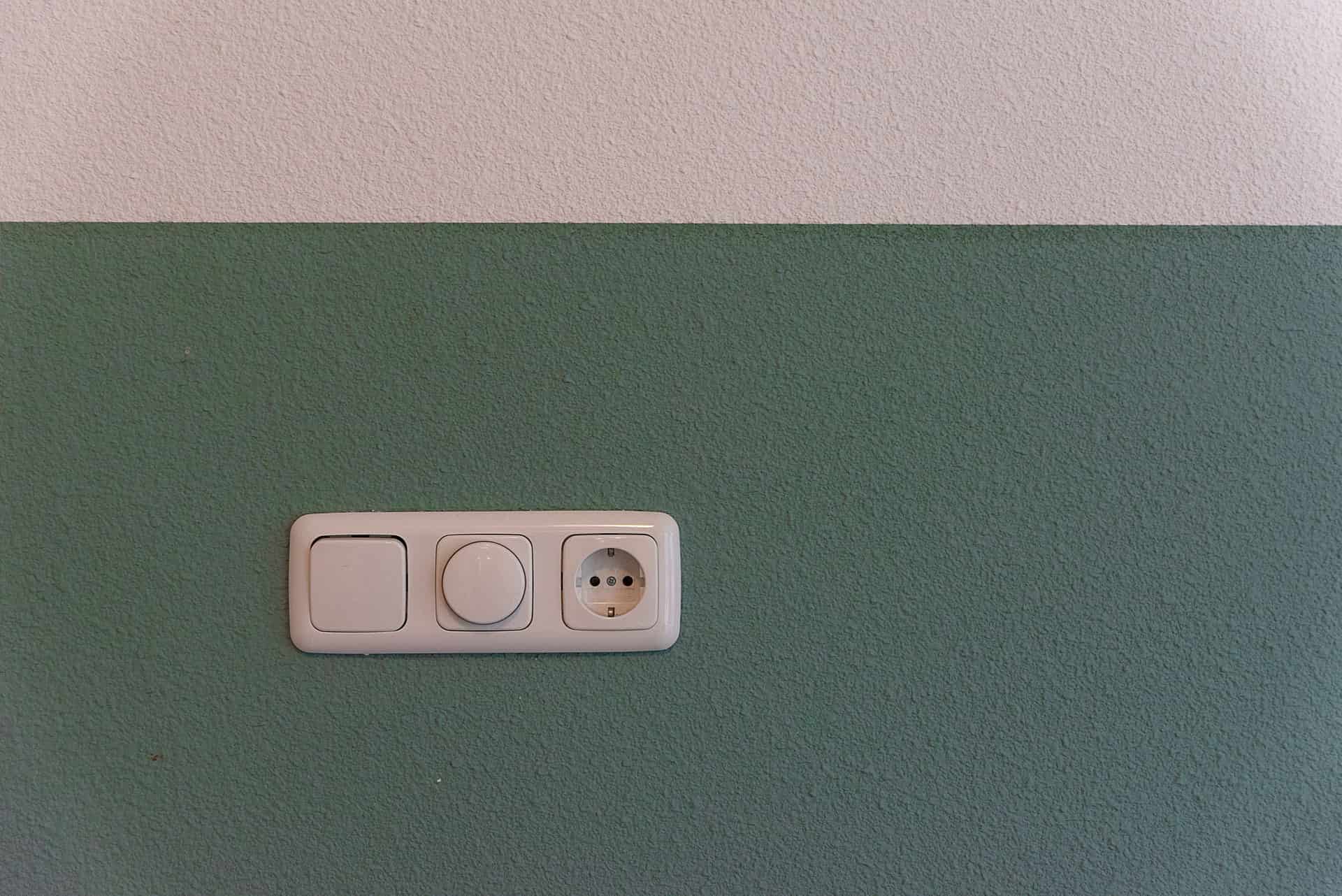 A white wall outlet with two sockets, close up