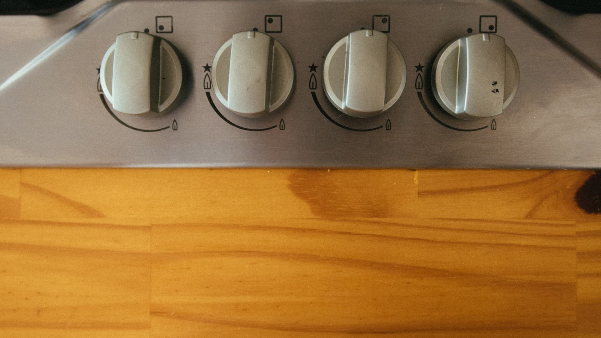The control knobs on the front of a kitchen stove